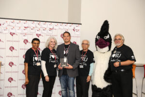 Dr. Boral with the Alumni Trailblazer Award