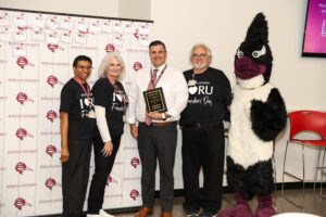 Dr. Howe with the Alumni Trailblazer Award