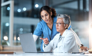 Doctor and nurse looking at a laptop