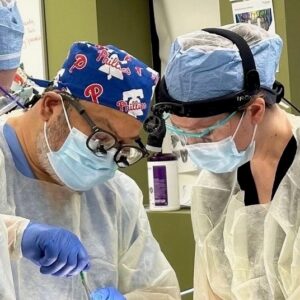 Dr. Kimberly Veltman performs a surgical operation with colleagues in the operating room.