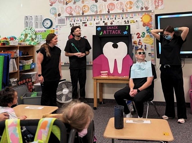 Dental students taught elementary school students about nutrition and oral hygiene at Kauri Sue Hamilton School