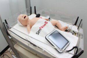 A newborn manikin in a nursing simulation lab at Roseman University