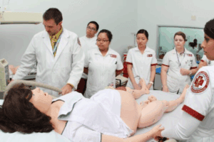 Nursing simulation lab at Roseman University with a pregnant manikin giving birth