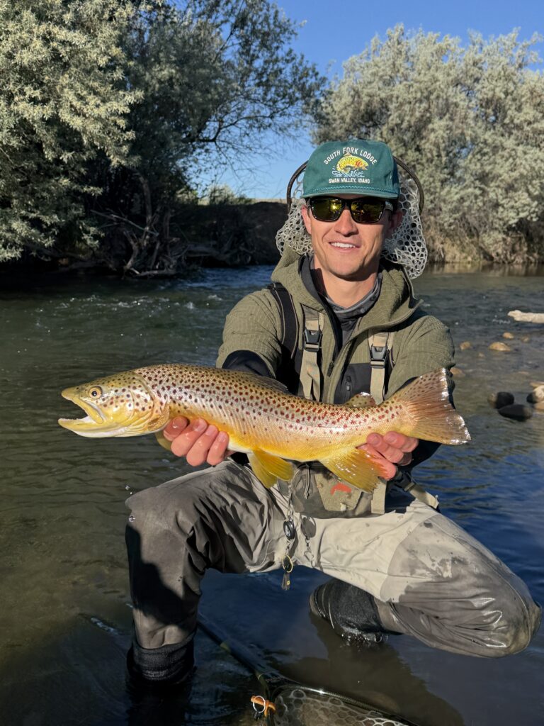 male holding a fish